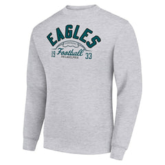 Philadelphia Eagles Starter Half Ball Team Graphic Tri-Blend Fleece Pullover Sweatshirt | NFL On sale